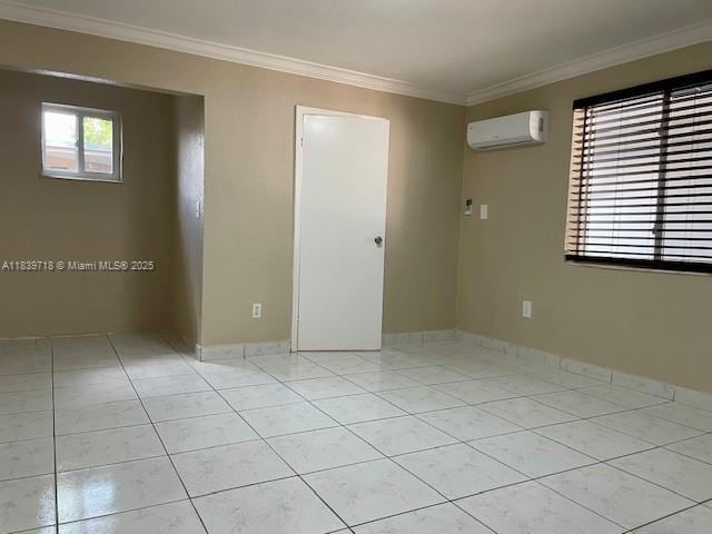 330 W 40th Pl, Hialeah, FL 33012 - spare room with a wall unit AC, ornamental molding, and light tile patterned floors