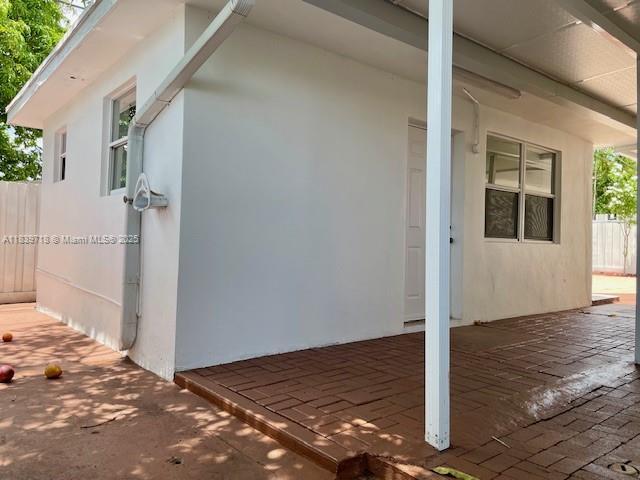 330 W 40th Pl, Hialeah, FL 33012 - view of property exterior featuring a patio area and stucco siding