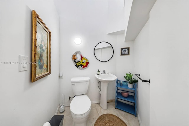 3200 Morris Ln, Miami, FL 33133 - bathroom featuring toilet and baseboards