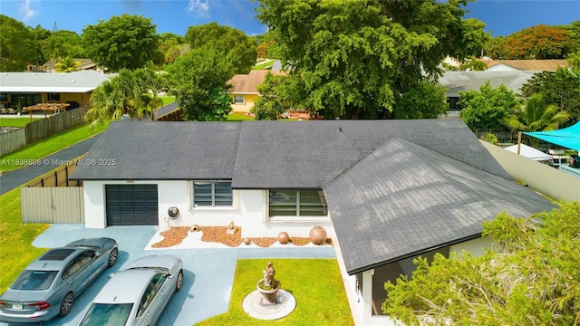 906 Cardinal Pl, Homestead, FL 33035 - view of front facade featuring a garage, stucco siding, and a shingled roof