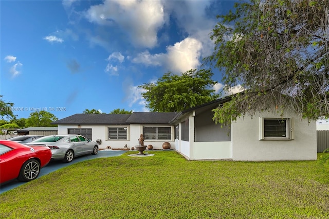 906 Cardinal Pl, Homestead, FL 33035 - view of front of property with an attached garage, a front yard, and stucco siding
