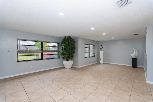 906 Cardinal Pl, Homestead, FL 33035 - empty room with recessed lighting, a textured ceiling, and light tile patterned flooring