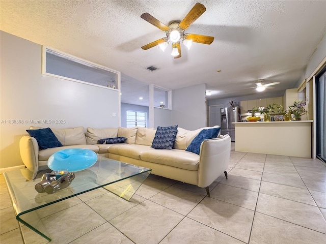 906 Cardinal Pl, Homestead, FL 33035 - living room with ceiling fan, a textured ceiling, and light tile patterned flooring