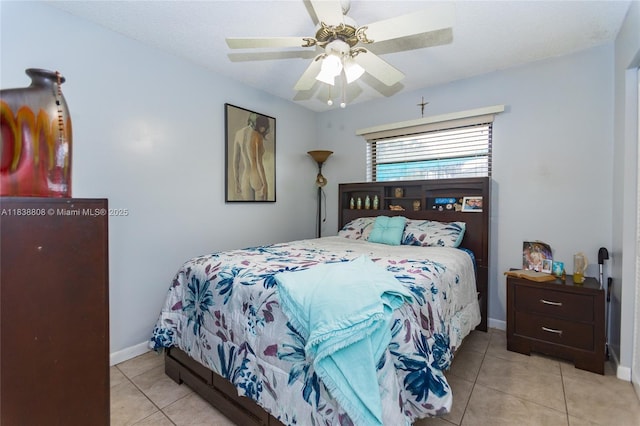 906 Cardinal Pl, Homestead, FL 33035 - tiled bedroom with baseboards and ceiling fan