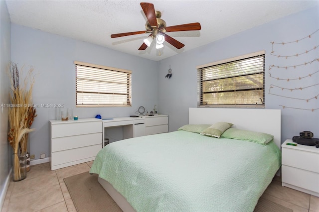 906 Cardinal Pl, Homestead, FL 33035 - bedroom with light tile patterned floors and ceiling fan