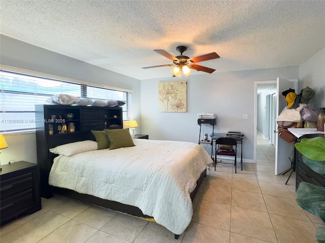 906 Cardinal Pl, Homestead, FL 33035 - bedroom featuring light tile patterned floors, a textured ceiling, and ceiling fan