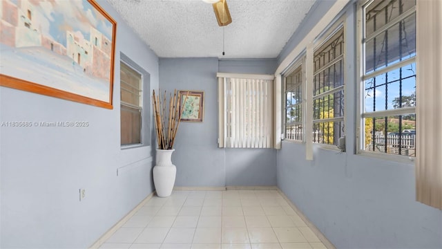 521 SE 5th St, Hialeah, FL 33010 - hall featuring a textured ceiling and baseboards