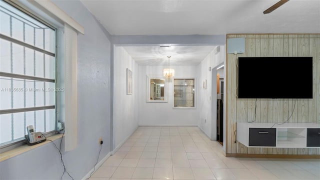 521 SE 5th St, Hialeah, FL 33010 - corridor with a chandelier and baseboards