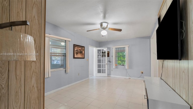 521 SE 5th St, Hialeah, FL 33010 - empty room featuring ceiling fan and light tile patterned flooring
