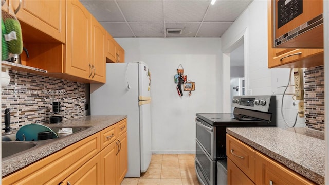 521 SE 5th St, Hialeah, FL 33010 - kitchen with stainless steel appliances, a paneled ceiling, tasteful backsplash, open shelves, and light tile patterned flooring
