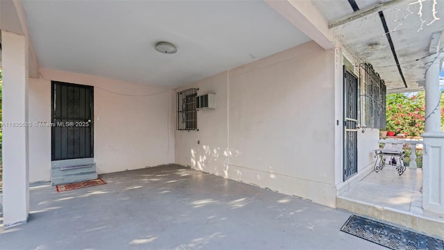 521 SE 5th St, Hialeah, FL 33010 - view of patio / terrace with a wall mounted AC and a carport