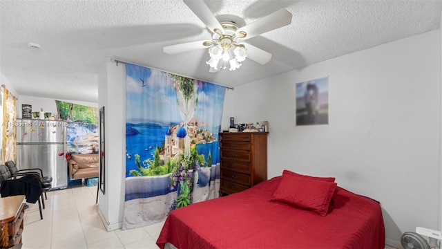 521 SE 5th St, Hialeah, FL 33010 - tiled bedroom with a textured ceiling and a ceiling fan