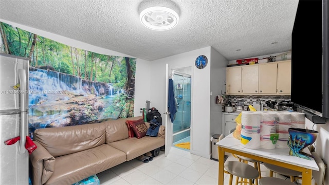 521 SE 5th St, Hialeah, FL 33010 - living room featuring a textured ceiling and light tile patterned flooring