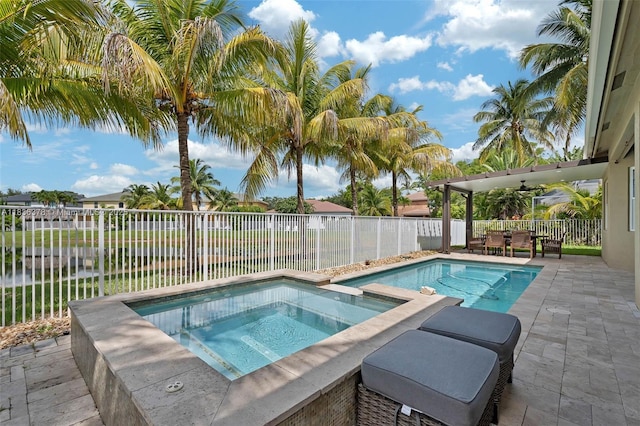 19252 N Hibiscus St, Weston, FL 33332 - view of swimming pool featuring an in-ground hot tub, a patio area, and a fenced backyard