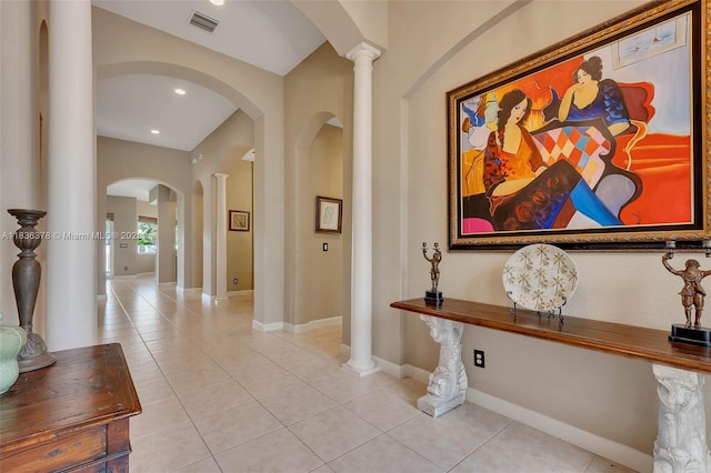 19252 N Hibiscus St, Weston, FL 33332 - hallway with arched walkways, light tile patterned floors, decorative columns, and recessed lighting