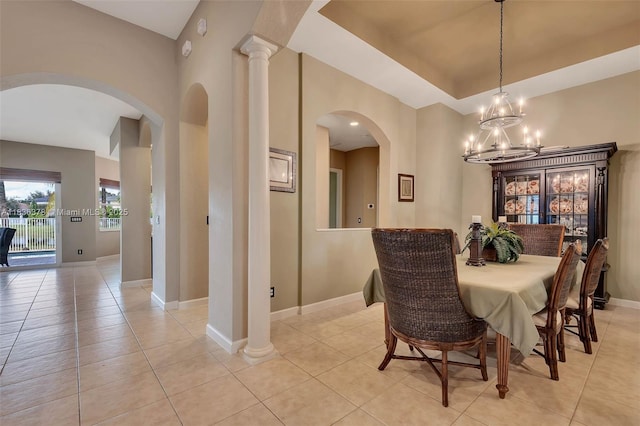 19252 N Hibiscus St, Weston, FL 33332 - dining room featuring arched walkways, light tile patterned flooring, a chandelier, and a raised ceiling
