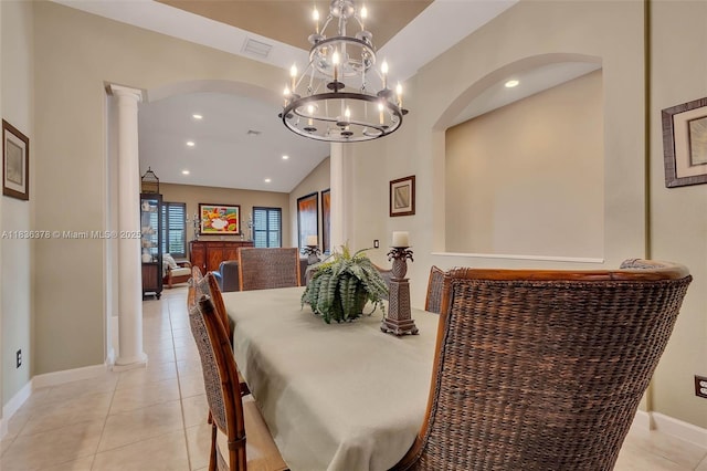 19252 N Hibiscus St, Weston, FL 33332 - dining area with lofted ceiling, arched walkways, decorative columns, light tile patterned floors, and a chandelier