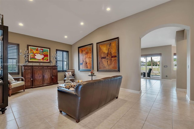 19252 N Hibiscus St, Weston, FL 33332 - living area with arched walkways, light tile patterned floors, lofted ceiling, and recessed lighting