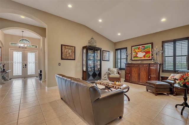 19252 N Hibiscus St, Weston, FL 33332 - living room with arched walkways, light tile patterned flooring, recessed lighting, a chandelier, and lofted ceiling