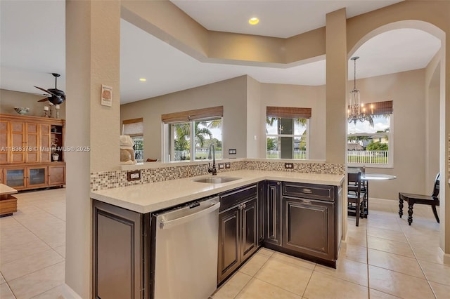 19252 N Hibiscus St, Weston, FL 33332 - kitchen with light countertops, dishwasher, light tile patterned floors, arched walkways, and recessed lighting