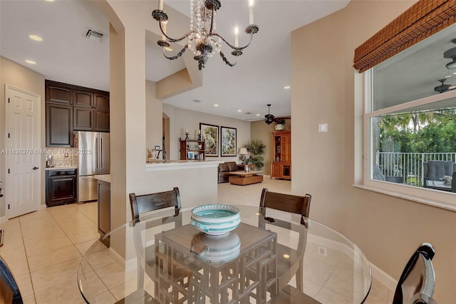 19252 N Hibiscus St, Weston, FL 33332 - dining space with light tile patterned flooring, a chandelier, arched walkways, and recessed lighting