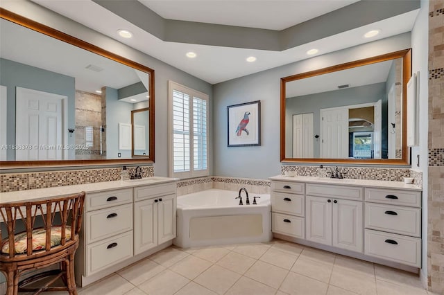 19252 N Hibiscus St, Weston, FL 33332 - bathroom with a garden tub, tile patterned floors, two vanities, recessed lighting, and tiled shower