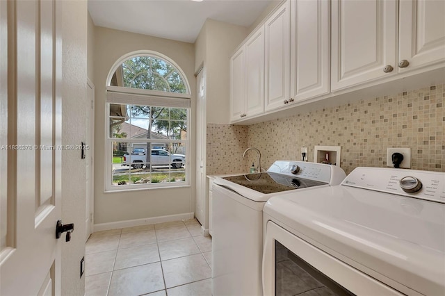 19252 N Hibiscus St, Weston, FL 33332 - laundry area with cabinet space, separate washer and dryer, and light tile patterned floors