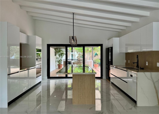 641 Nightingale Ave, Miami Springs, FL 33166 - kitchen with light marble finish flooring, white cabinetry, freestanding refrigerator, and modern cabinets