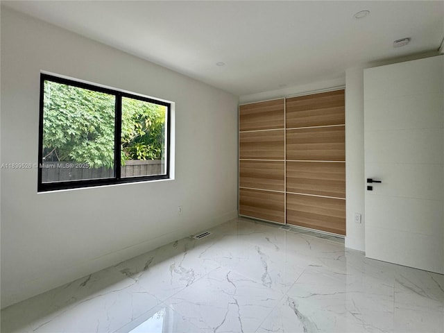 641 Nightingale Ave, Miami Springs, FL 33166 - empty room featuring marble finish floors and baseboards