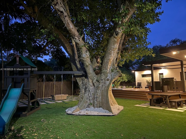 641 Nightingale Ave, Miami Springs, FL 33166 - yard at twilight featuring a playground