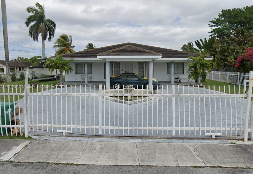 13895 SW 22nd St, Miami, FL 33175 - ranch-style house featuring a fenced front yard and stucco siding