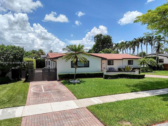 9031 SW 66th Ter, Miami, FL 33173 - view of front of house with stucco siding and a tile roof