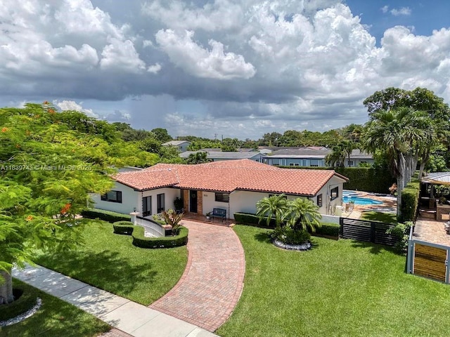 9031 SW 66th Ter, Miami, FL 33173 - mediterranean / spanish home featuring a tiled roof, decorative driveway, and stucco siding