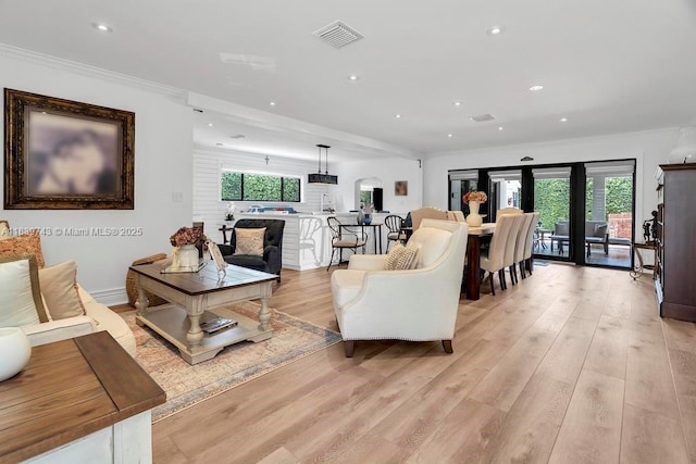 9031 SW 66th Ter, Miami, FL 33173 - living area with light wood-type flooring, crown molding, recessed lighting, and arched walkways