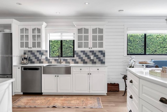 9031 SW 66th Ter, Miami, FL 33173 - kitchen with dishwasher, healthy amount of natural light, light wood-style floors, light countertops, and recessed lighting