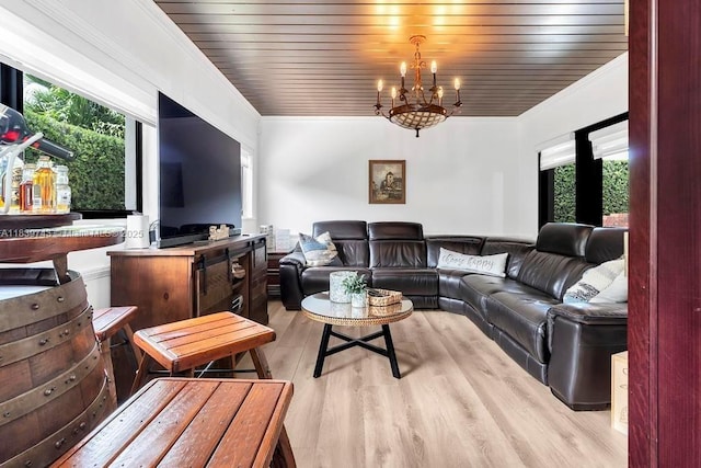 9031 SW 66th Ter, Miami, FL 33173 - living area with healthy amount of natural light, ornamental molding, a chandelier, and light wood finished floors