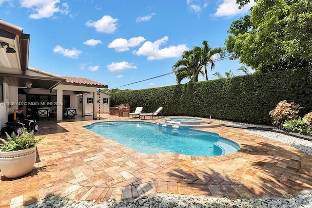 9031 SW 66th Ter, Miami, FL 33173 - view of pool featuring a patio, a pool with connected hot tub, and a fenced backyard