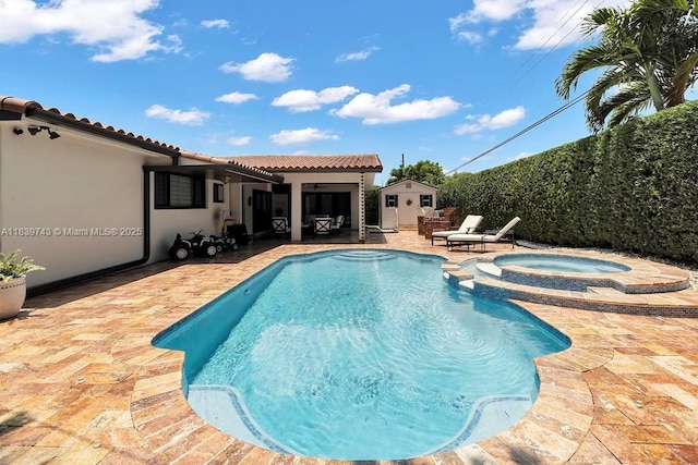 9031 SW 66th Ter, Miami, FL 33173 - view of pool featuring a patio area, a pool with connected hot tub, and an outdoor structure