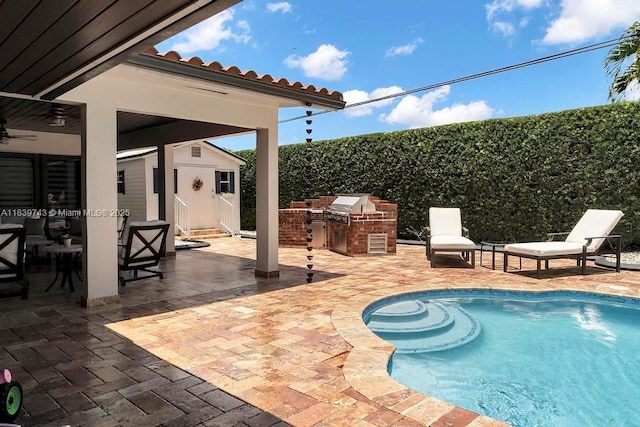 9031 SW 66th Ter, Miami, FL 33173 - view of pool with an outdoor kitchen, a patio, an outdoor structure, and ceiling fan