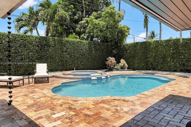9031 SW 66th Ter, Miami, FL 33173 - view of pool with a pool with connected hot tub, a patio, and a fenced backyard