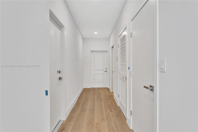 1563 NW 94th Way Unit 09, Coral Springs, FL 33071 - hall featuring recessed lighting and light wood-style flooring