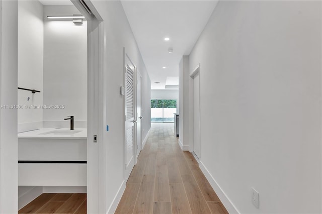 1563 NW 94th Way Unit 09, Coral Springs, FL 33071 - hallway with light wood finished floors and recessed lighting