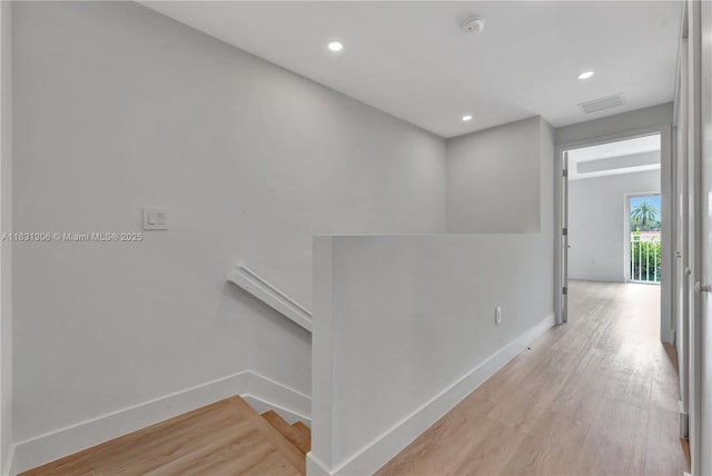 1563 NW 94th Way Unit 09, Coral Springs, FL 33071 - hall featuring light wood-style flooring, an upstairs landing, and recessed lighting