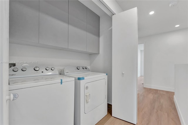 1563 NW 94th Way Unit 09, Coral Springs, FL 33071 - laundry room with cabinet space, independent washer and dryer, light wood finished floors, and recessed lighting