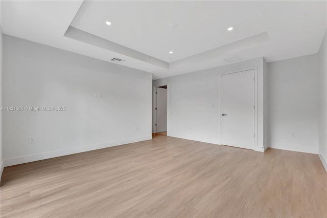 1563 NW 94th Way Unit 09, Coral Springs, FL 33071 - unfurnished bedroom with a tray ceiling, light wood-style floors, and recessed lighting