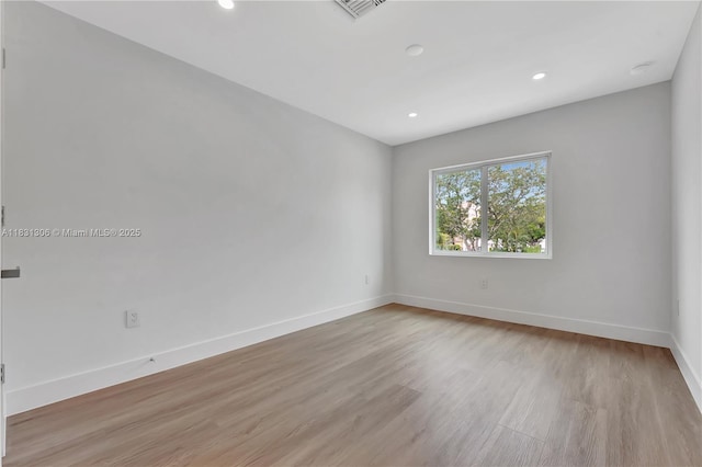 1563 NW 94th Way Unit 09, Coral Springs, FL 33071 - spare room with light wood-style flooring and recessed lighting