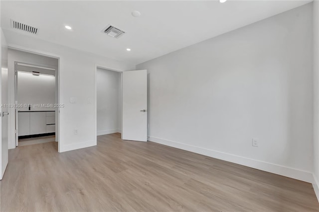 1563 NW 94th Way Unit 09, Coral Springs, FL 33071 - unfurnished bedroom featuring light wood-type flooring and recessed lighting