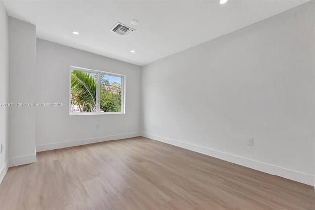 1563 NW 94th Way Unit 09, Coral Springs, FL 33071 - empty room featuring light wood-style flooring and recessed lighting