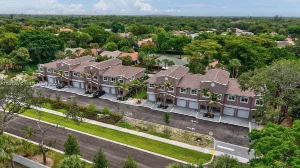 1563 NW 94th Way Unit 09, Coral Springs, FL 33071 - aerial view of residential area with a heavily wooded area