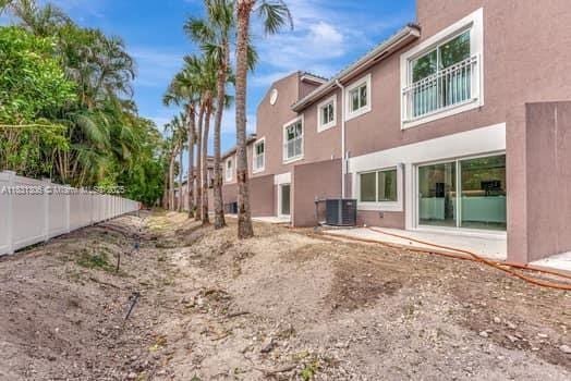 1563 NW 94th Way Unit 09, Coral Springs, FL 33071 - back of house featuring stucco siding